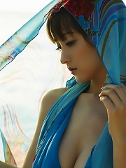 Sensual asian goddess looks incredible in her white bikini